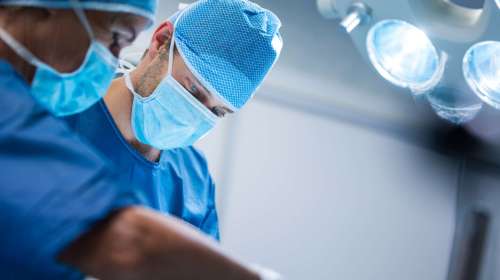 Surgeons performing operation in operation room at the hospital