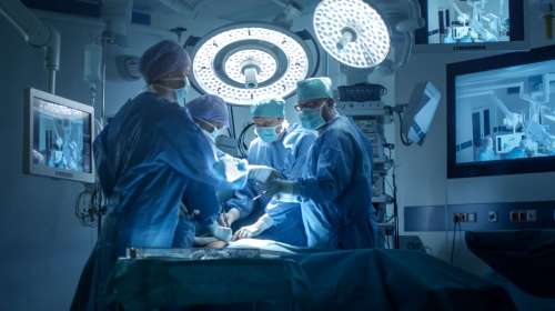 Medical Team Performing Surgical Operation in Modern Operating Room